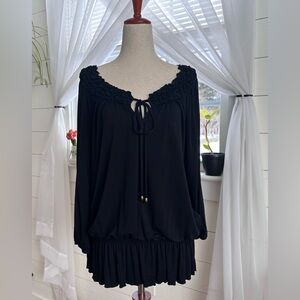 Boston Proper black top with a smocked neckline and waist.
Size: Medium